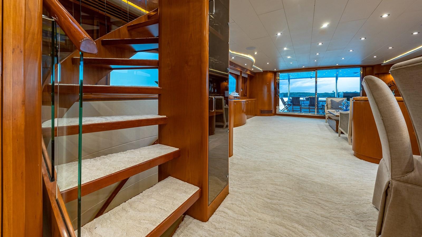 a room with a bed and a chair aboard B HAPPY Yacht for Sale