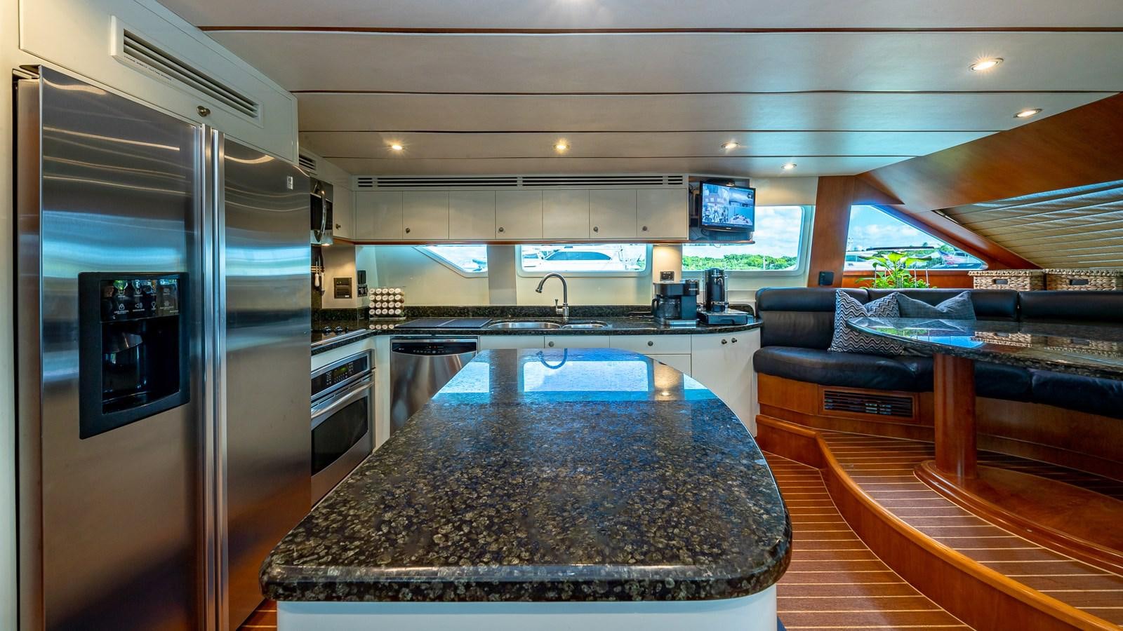 a kitchen with a large island aboard B HAPPY Yacht for Sale