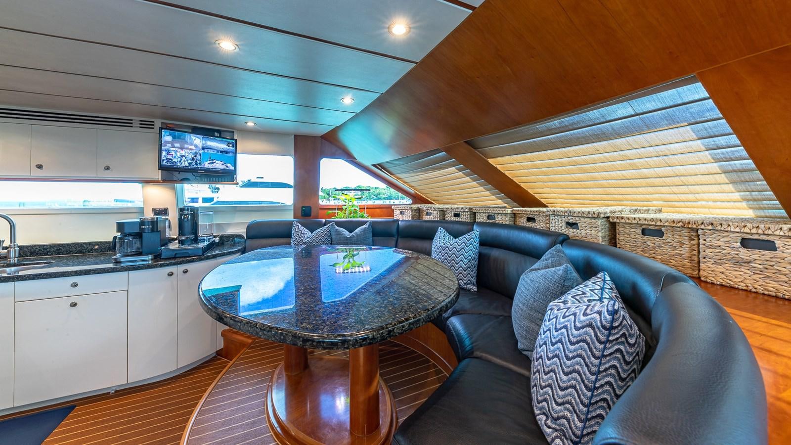 a living room with a couch and a table aboard B HAPPY Yacht for Sale