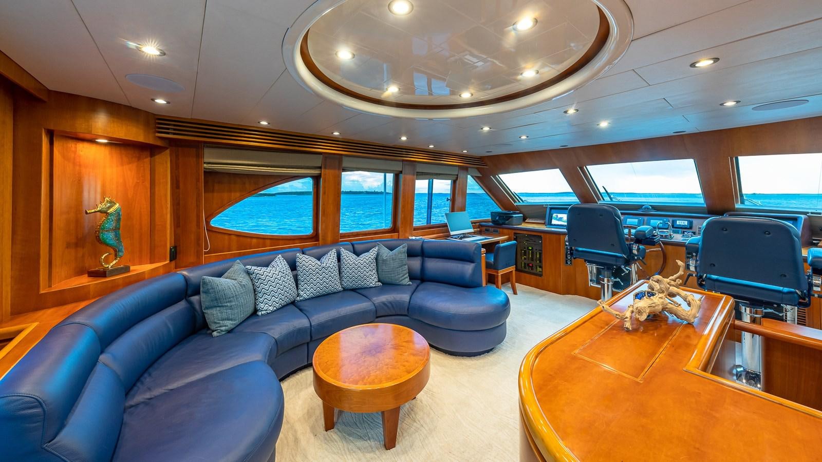a living room with a couch and a table aboard B HAPPY Yacht for Sale