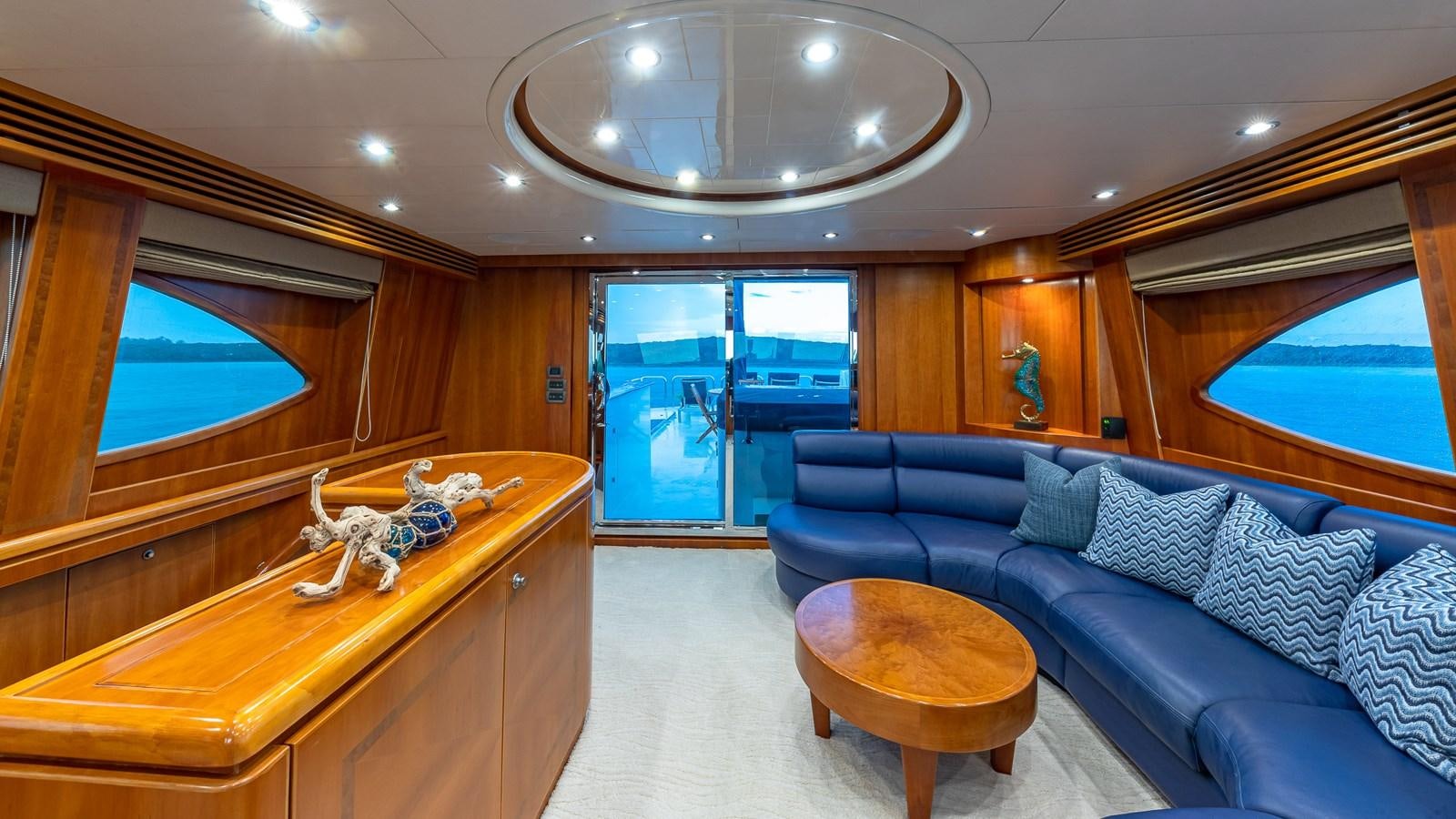 a room with a couch and a table aboard B HAPPY Yacht for Sale