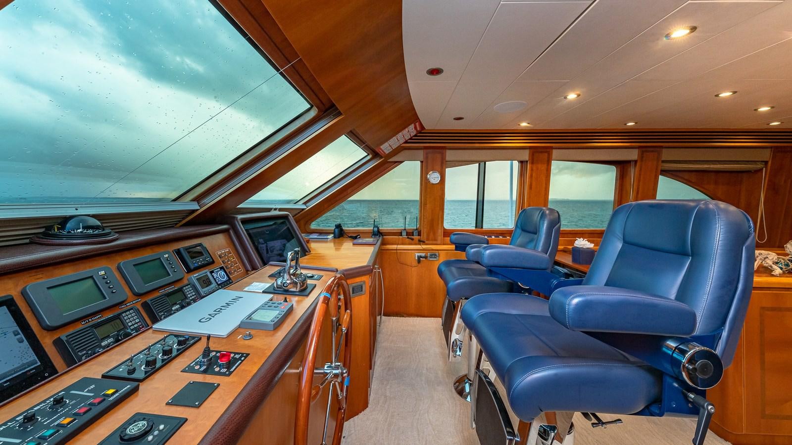 an airplane cockpit with a desk and chairs aboard B HAPPY Yacht for Sale