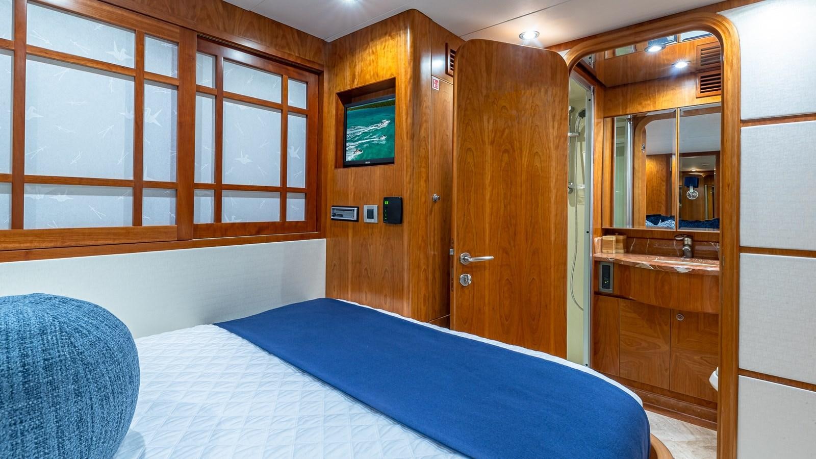 a room with a bed and a closet aboard B HAPPY Yacht for Sale