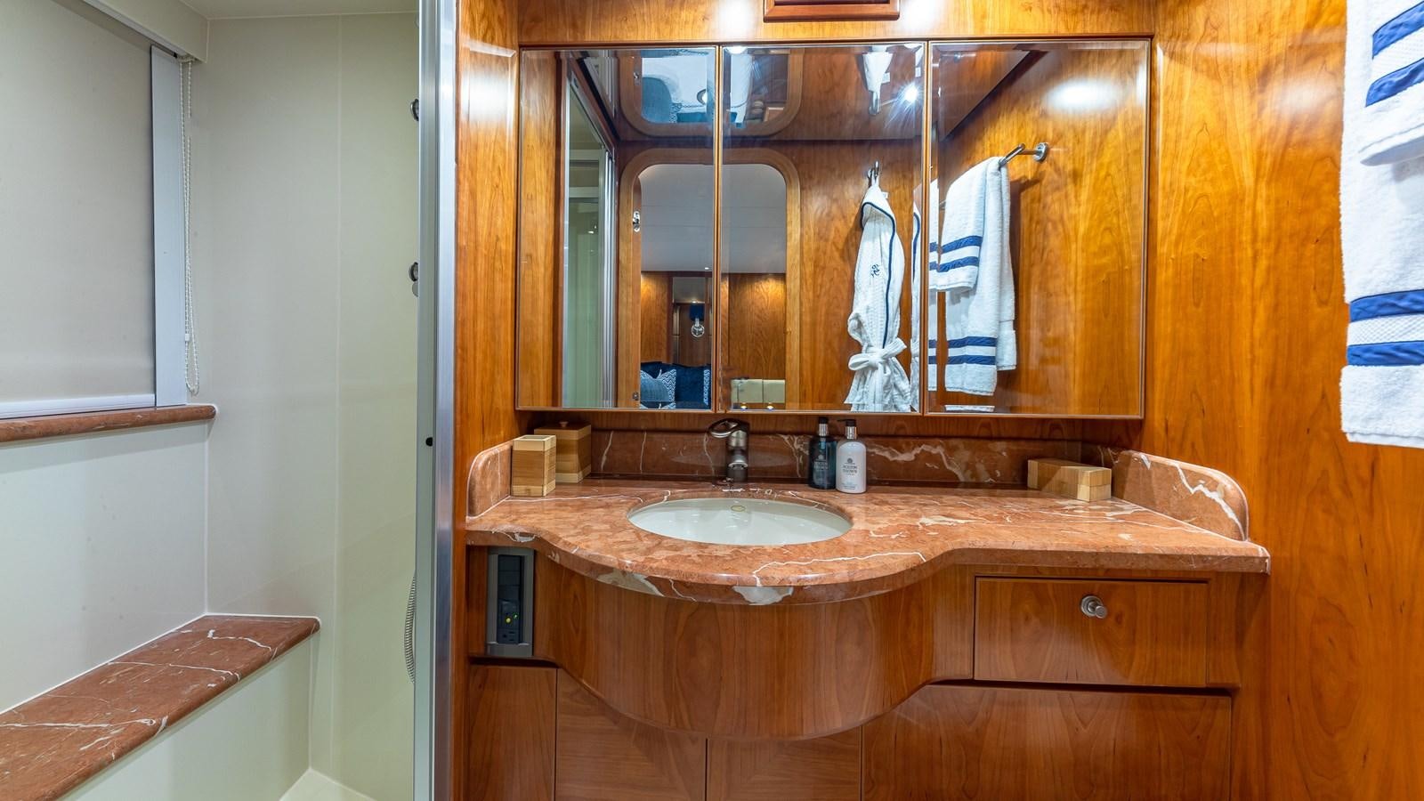 a bathroom with a sink and a mirror aboard B HAPPY Yacht for Sale