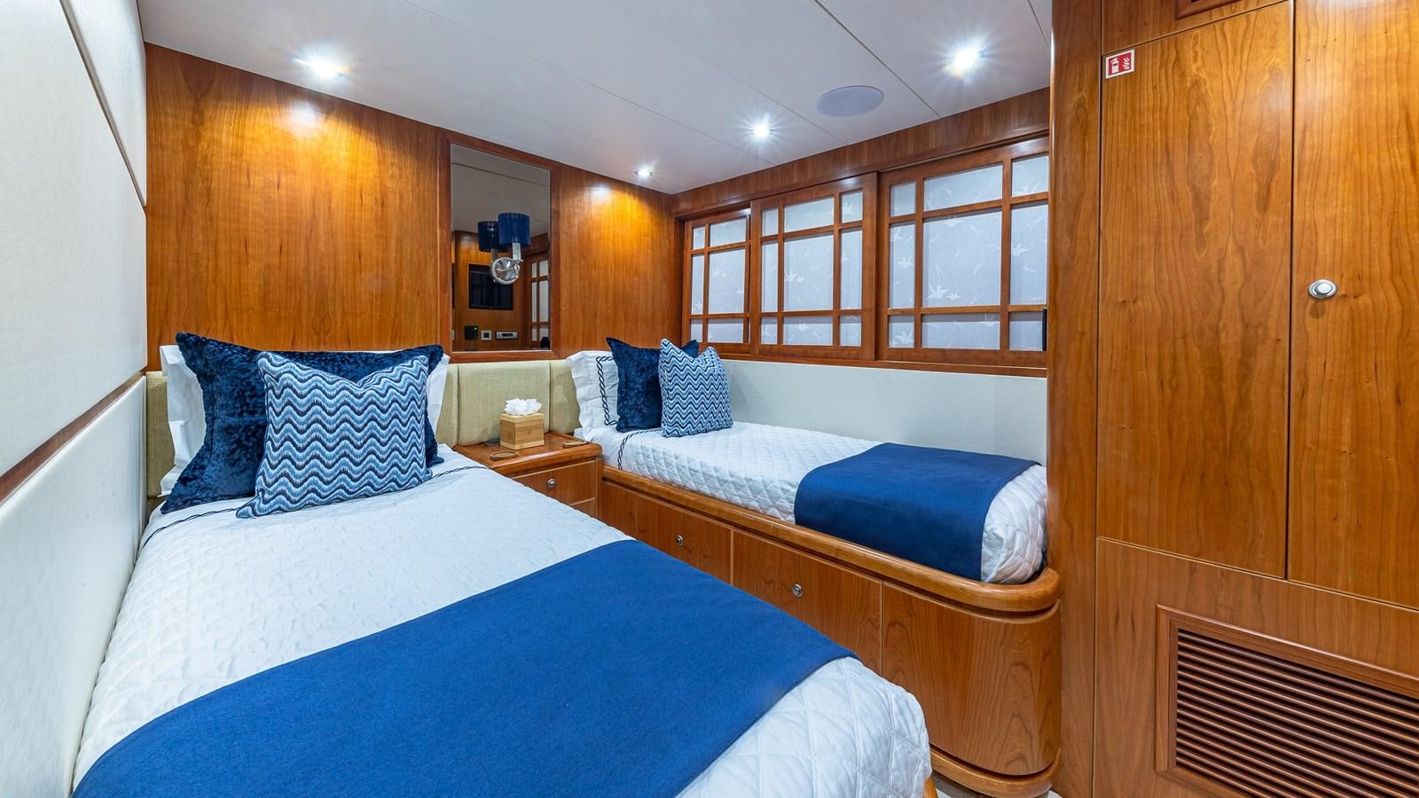 a room with two beds aboard B HAPPY Yacht for Sale