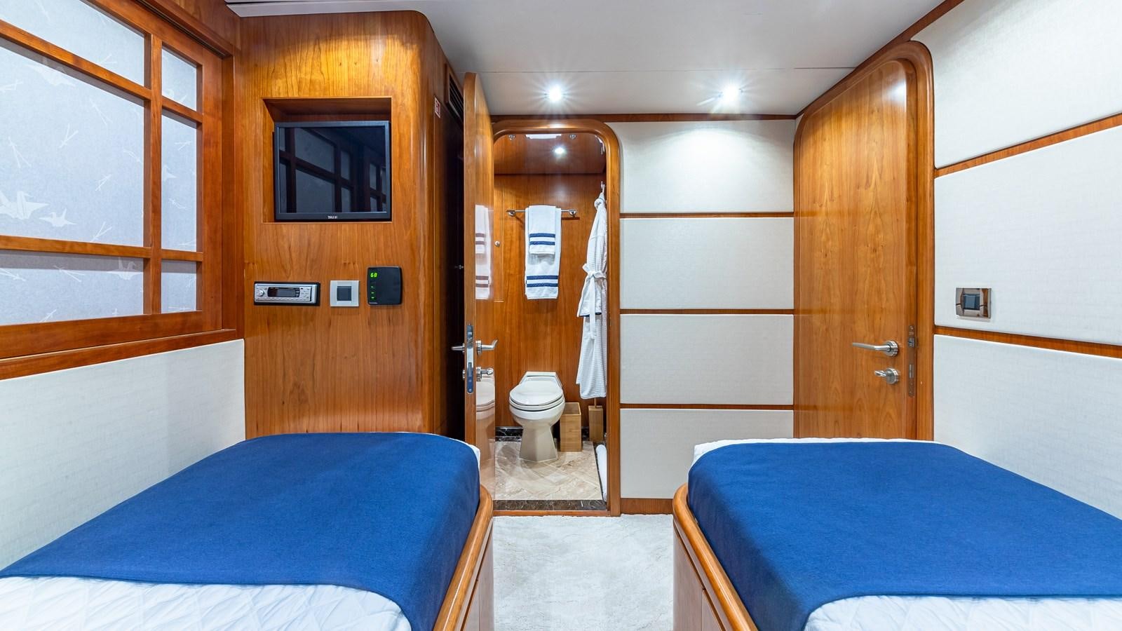 a room with a bed and a mirror aboard B HAPPY Yacht for Sale