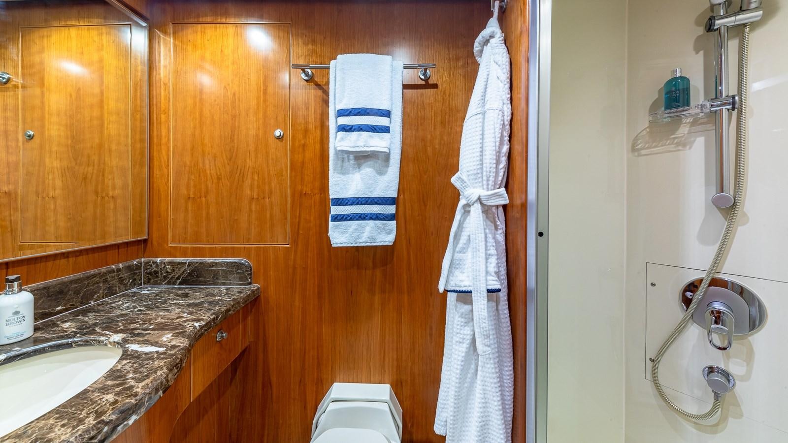 a bathroom with a sink and a towel on the wall aboard B HAPPY Yacht for Sale