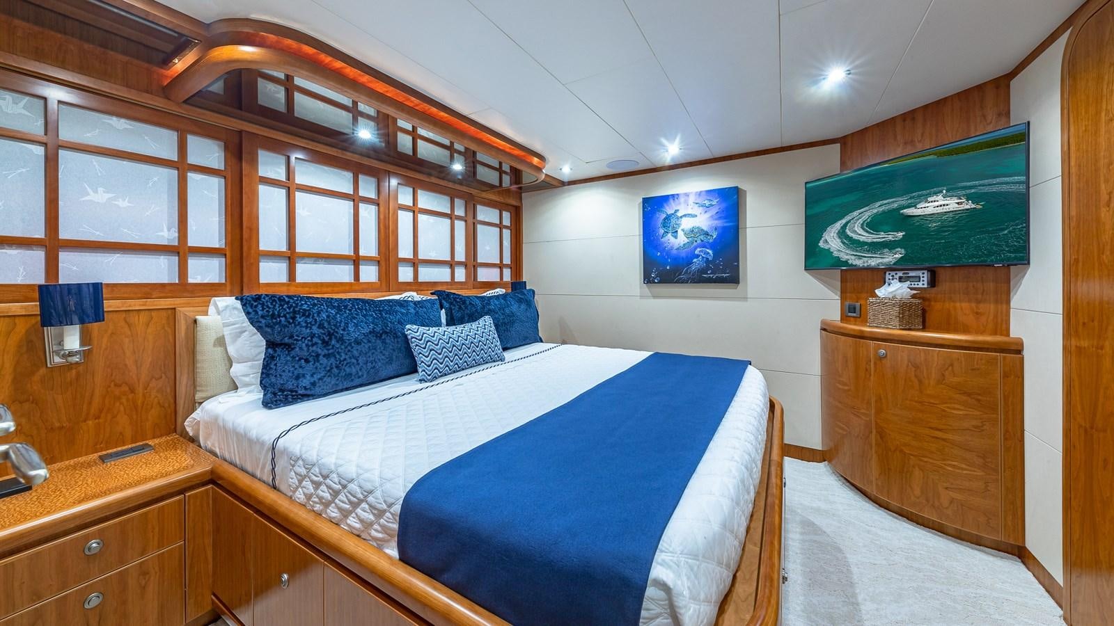 a bedroom with a bed and a tv aboard B HAPPY Yacht for Sale
