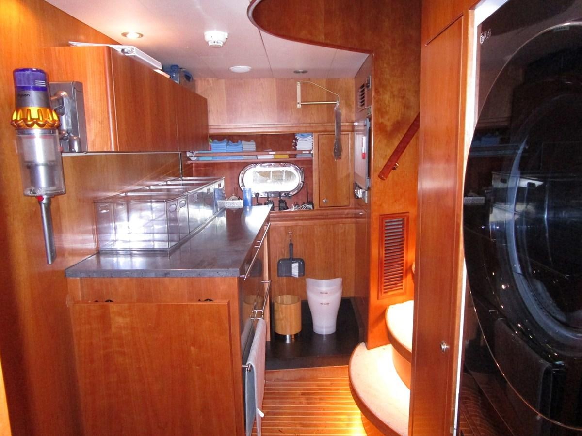 a kitchen with a large glass window aboard B HAPPY Yacht for Sale