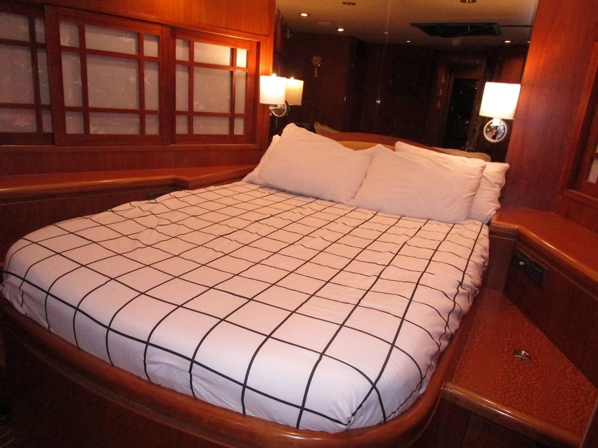 a bed with white sheets aboard B HAPPY Yacht for Sale