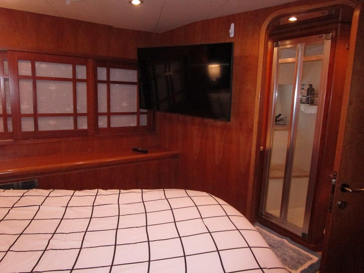 a room with a tiled floor and a wood cabinet aboard B HAPPY Yacht for Sale