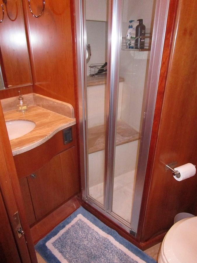 a bathroom with a shower and sink aboard B HAPPY Yacht for Sale