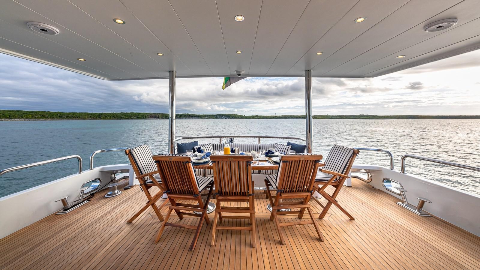 a group of chairs on a boat aboard B HAPPY Yacht for Sale
