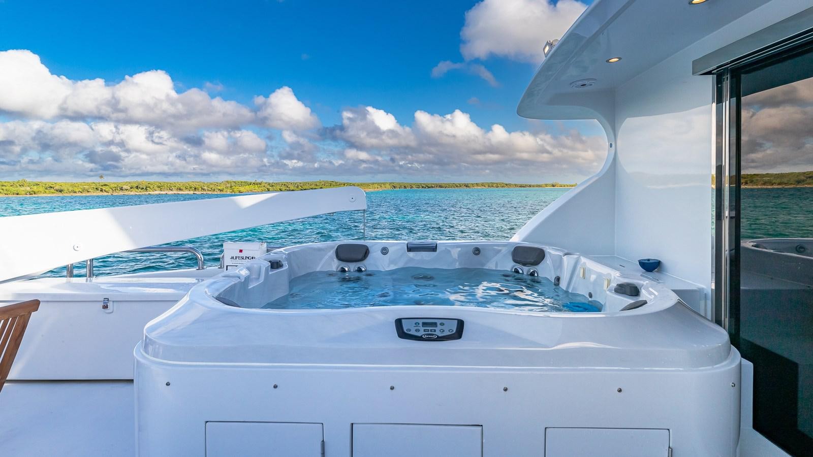 a large white boat on a large body of water aboard B HAPPY Yacht for Sale