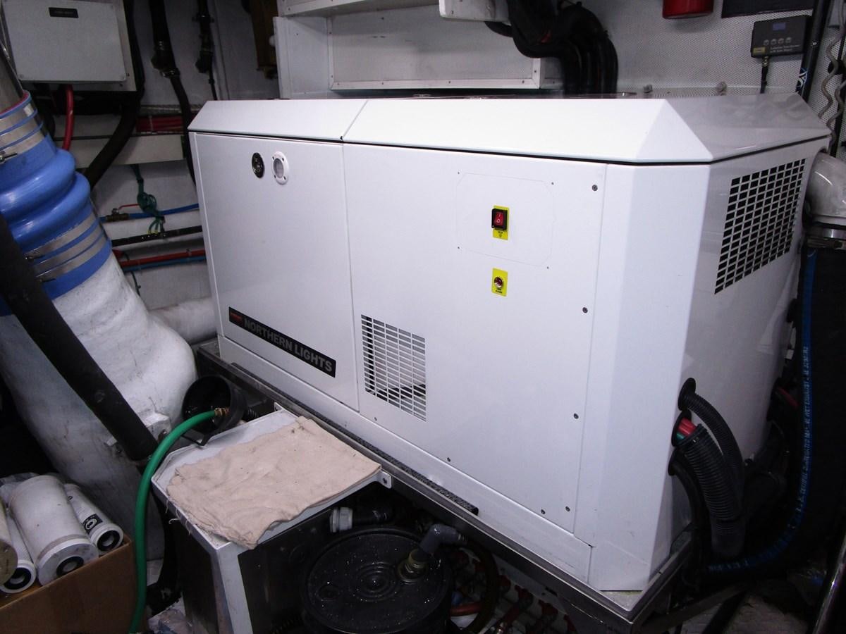 a white machine with a black cable aboard B HAPPY Yacht for Sale