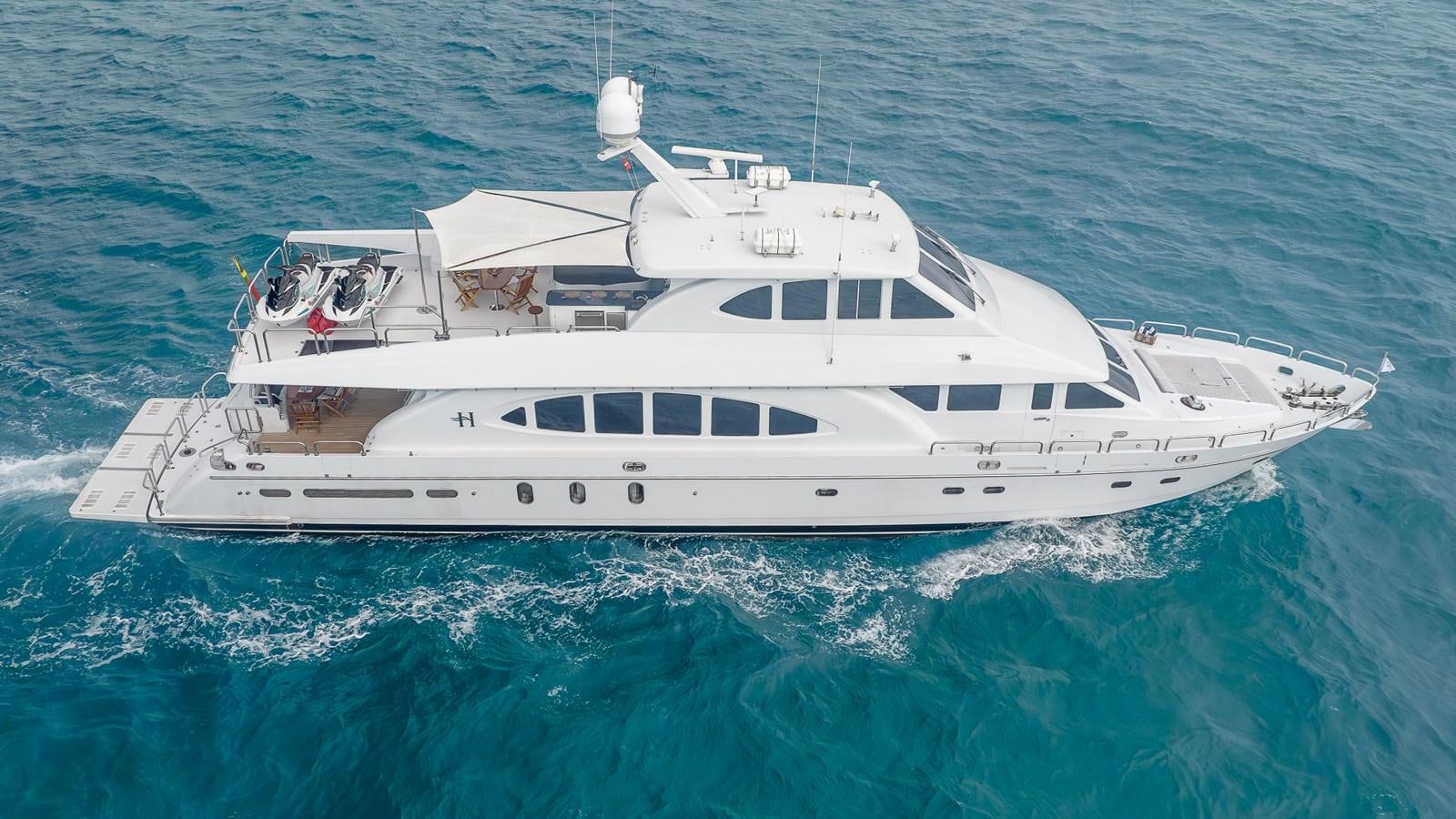 a white yacht in the ocean aboard B HAPPY Yacht for Sale