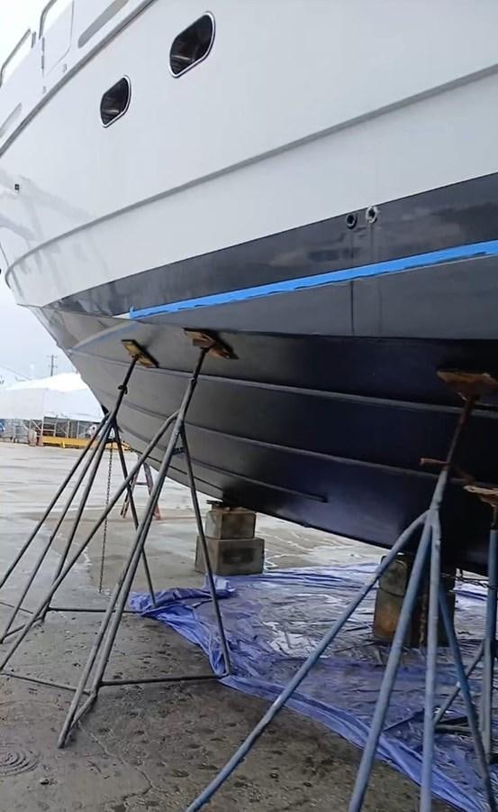 a boat with a blue tarp aboard B HAPPY Yacht for Sale
