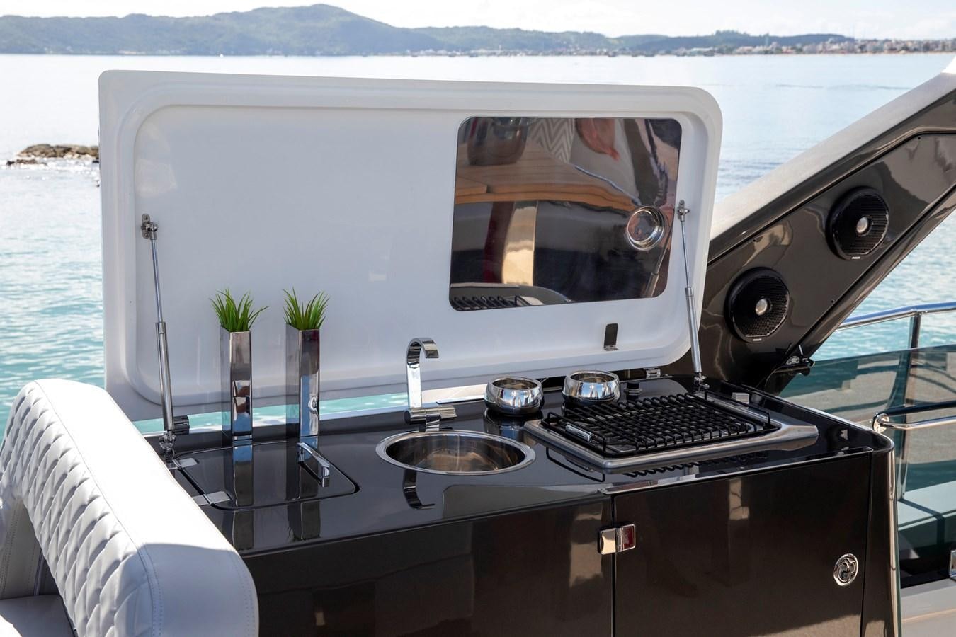 a boat with a sink and a computer on it aboard SCHAEFER 660 Yacht for Sale