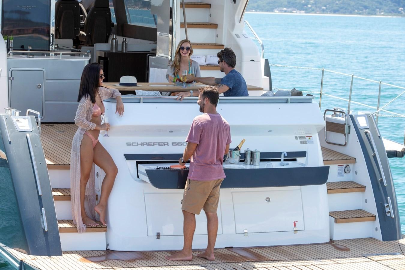 a group of people on a boat aboard SCHAEFER 660 Yacht for Sale
