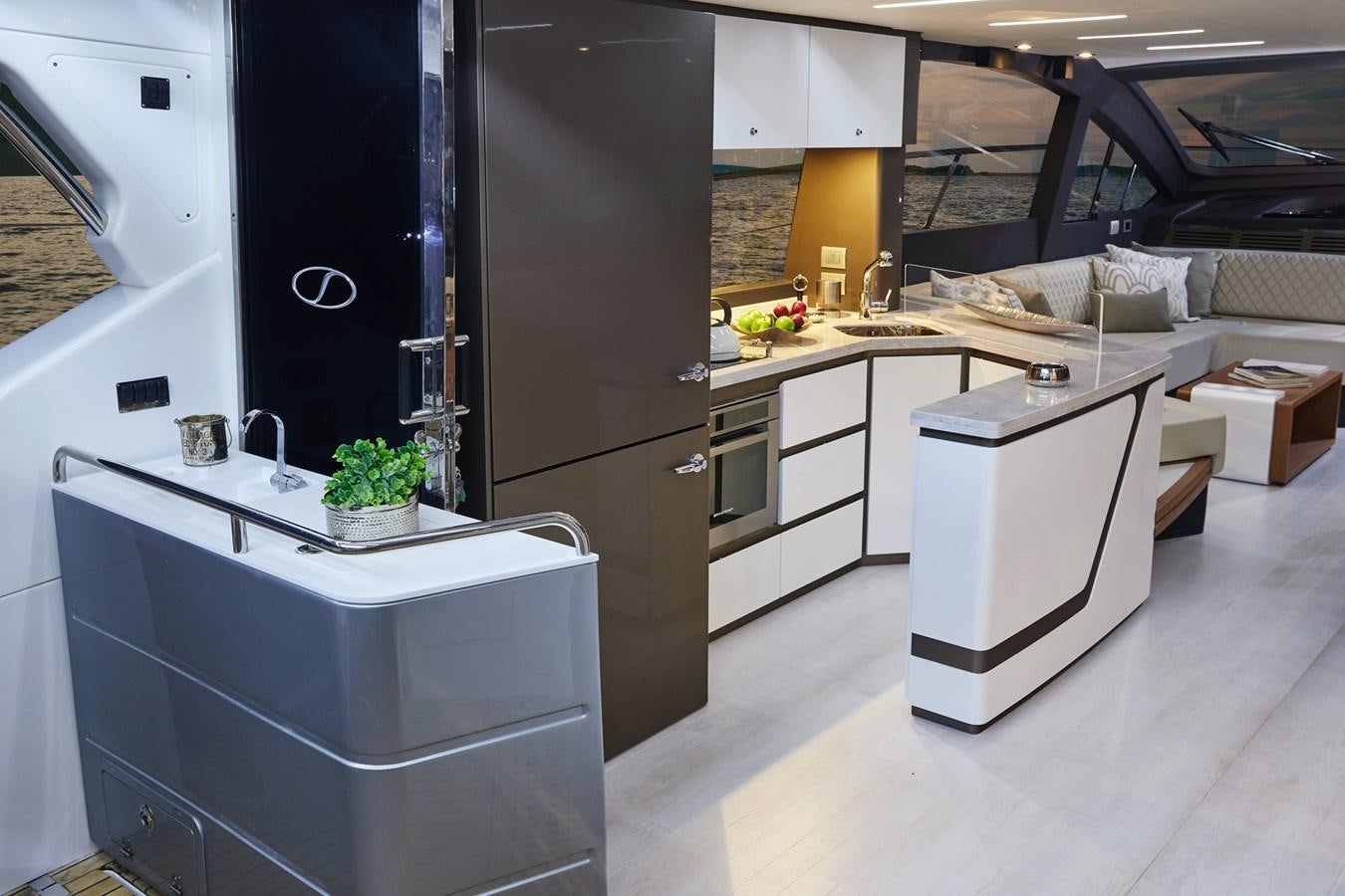 a kitchen with a refrigerator and a sink aboard SCHAEFER 660 Yacht for Sale