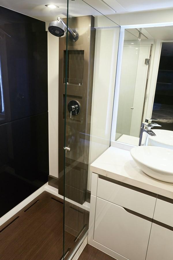 a bathroom with a glass shower aboard SCHAEFER 660 Yacht for Sale