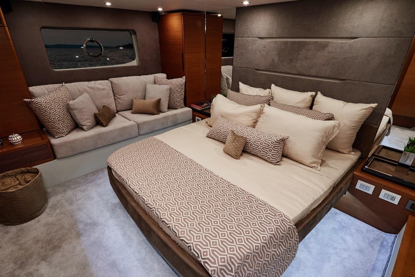 a bed and a couch in a room aboard SCHAEFER 660 Yacht for Sale