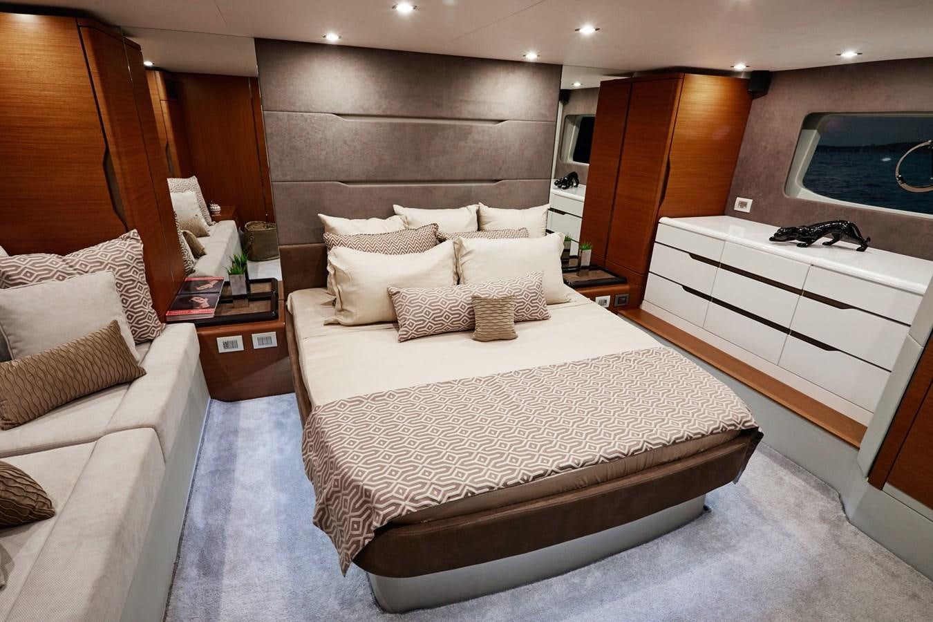 a room with a bed and a television aboard SCHAEFER 660 Yacht for Sale