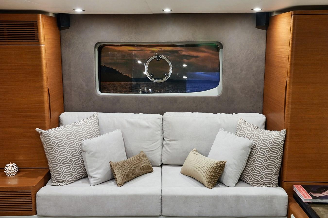 a white couch with pillows aboard SCHAEFER 660 Yacht for Sale