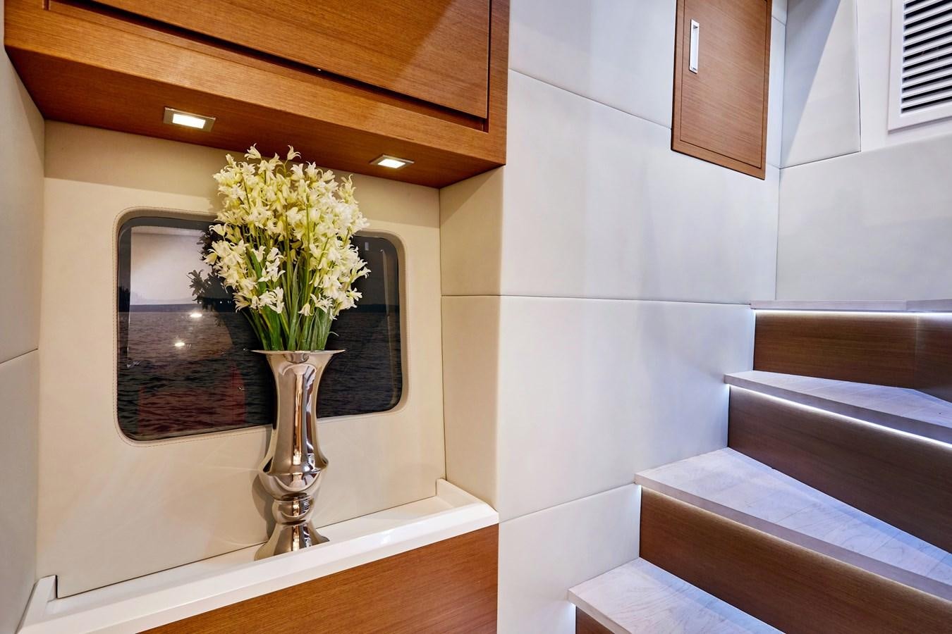 a vase of flowers on a table aboard SCHAEFER 660 Yacht for Sale