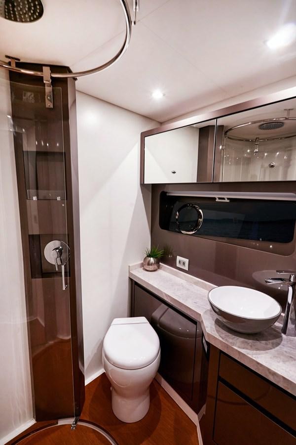 a bathroom with a sink toilet and a shower aboard SCHAEFER 660 Yacht for Sale
