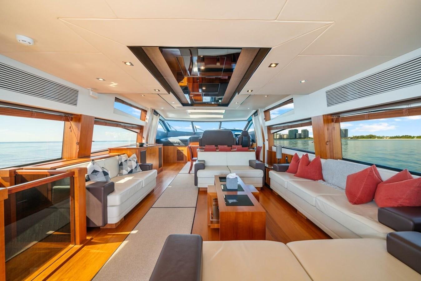 a living room with a large window aboard PREDATOR 84 Yacht for Sale