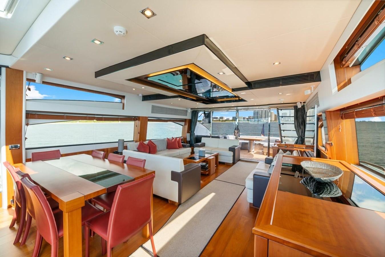 a room with a table and chairs aboard PREDATOR 84 Yacht for Sale