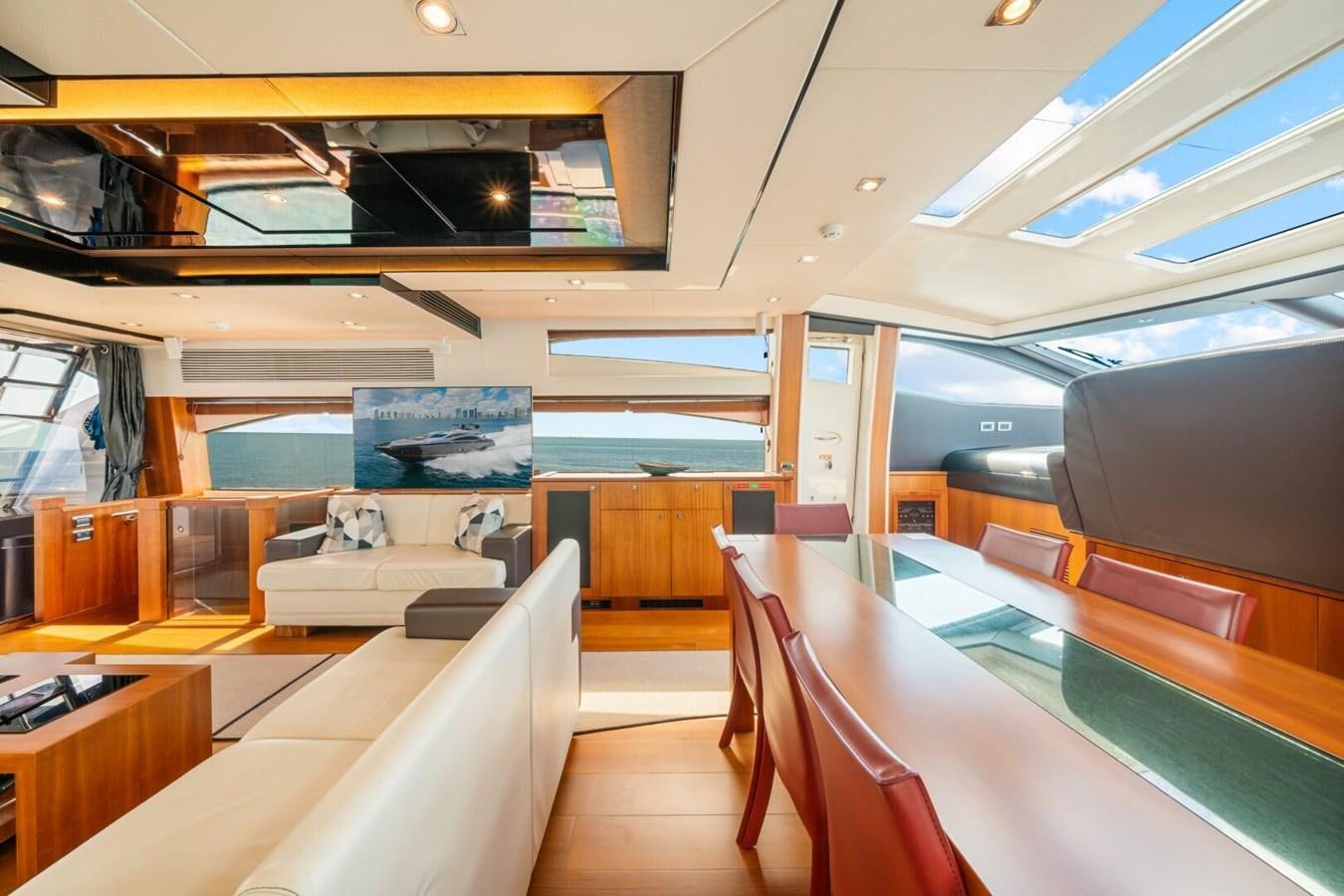 a room with a couch and a table aboard PREDATOR 84 Yacht for Sale