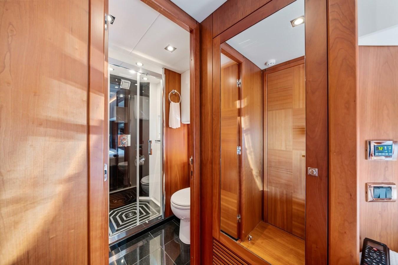 a bathroom with a glass shower aboard PREDATOR 84 Yacht for Sale