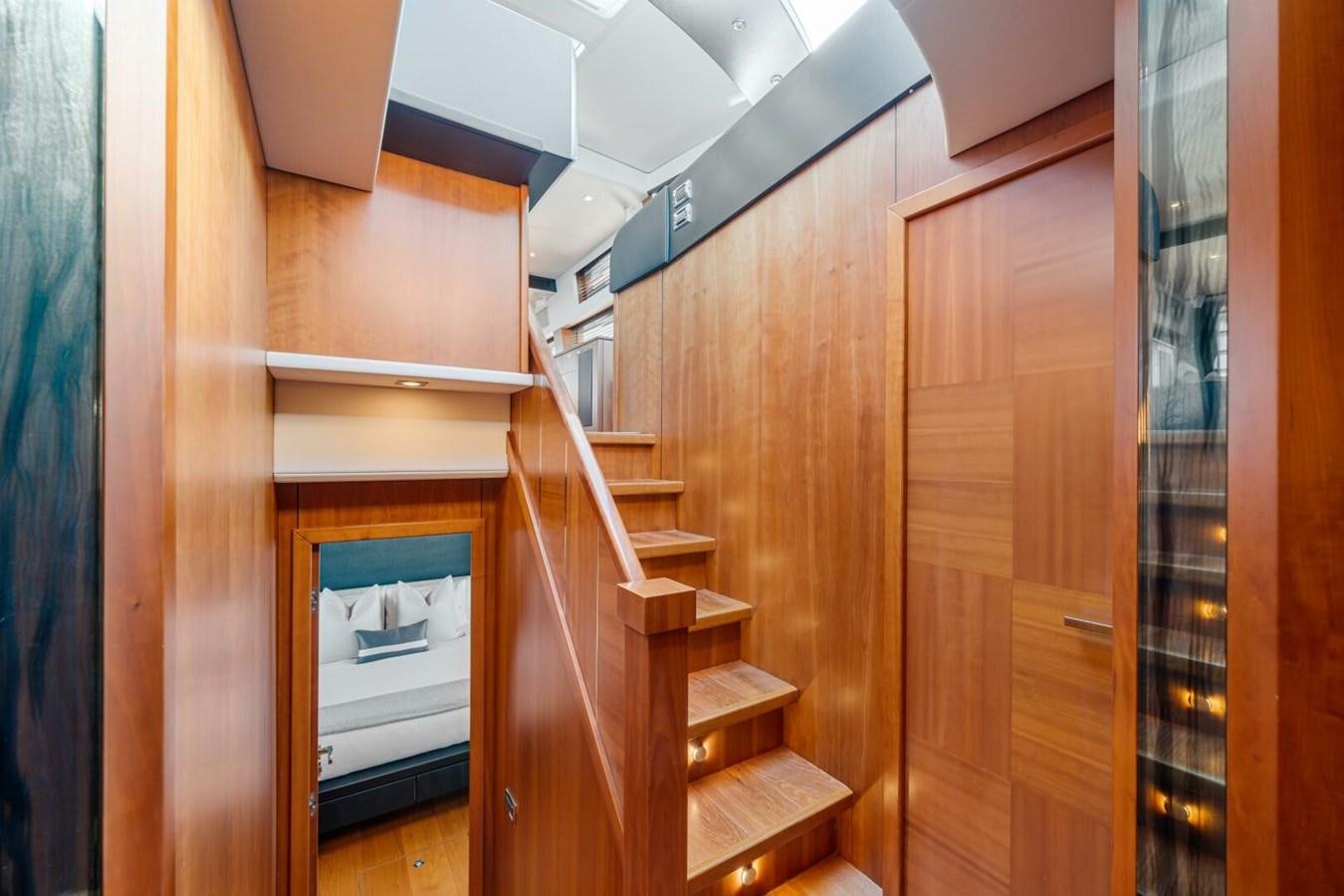 a room with wooden cabinets aboard PREDATOR 84 Yacht for Sale