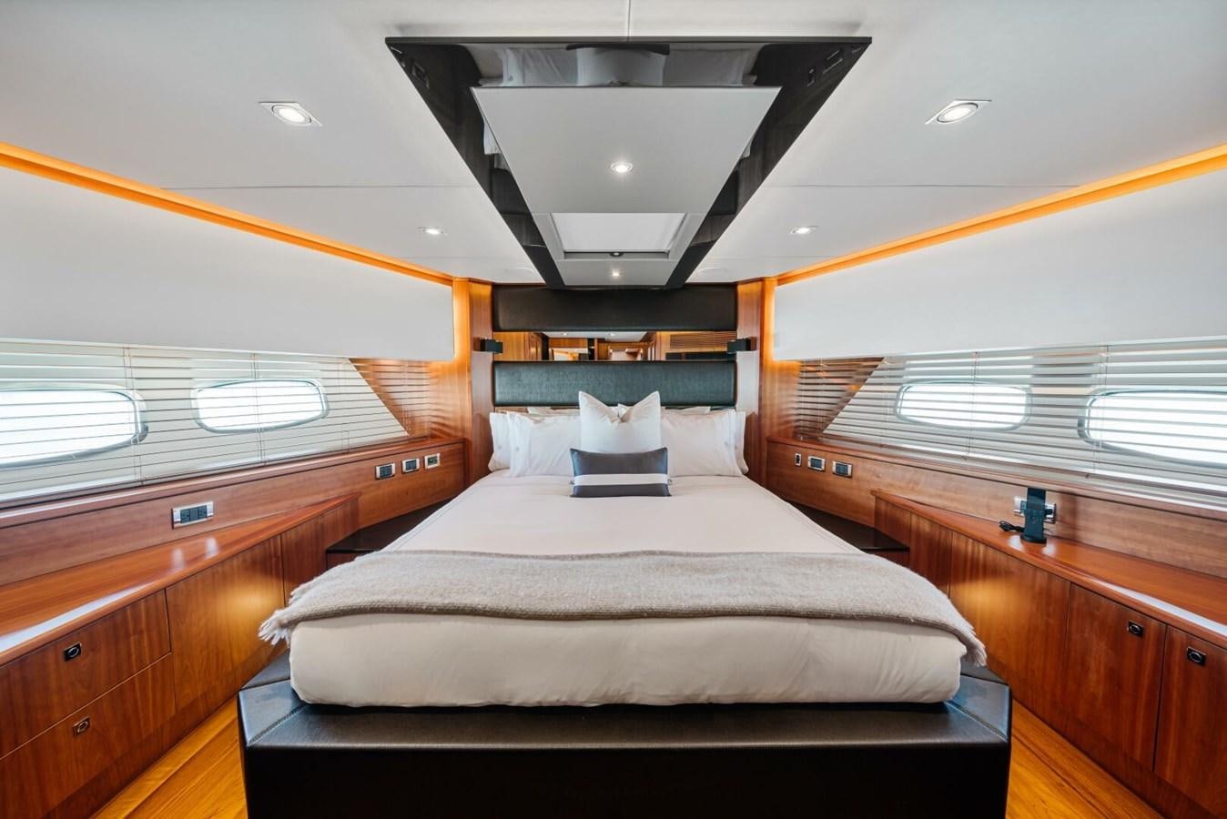 a bed in a room aboard PREDATOR 84 Yacht for Sale