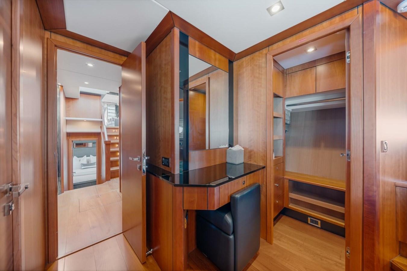 a room with wooden cabinets aboard PREDATOR 84 Yacht for Sale