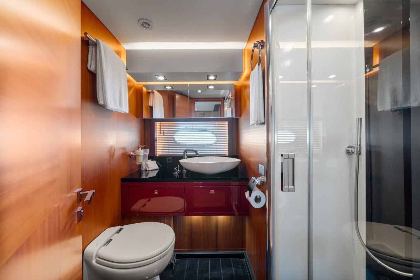 a bathroom with a sink and a toilet aboard PREDATOR 84 Yacht for Sale