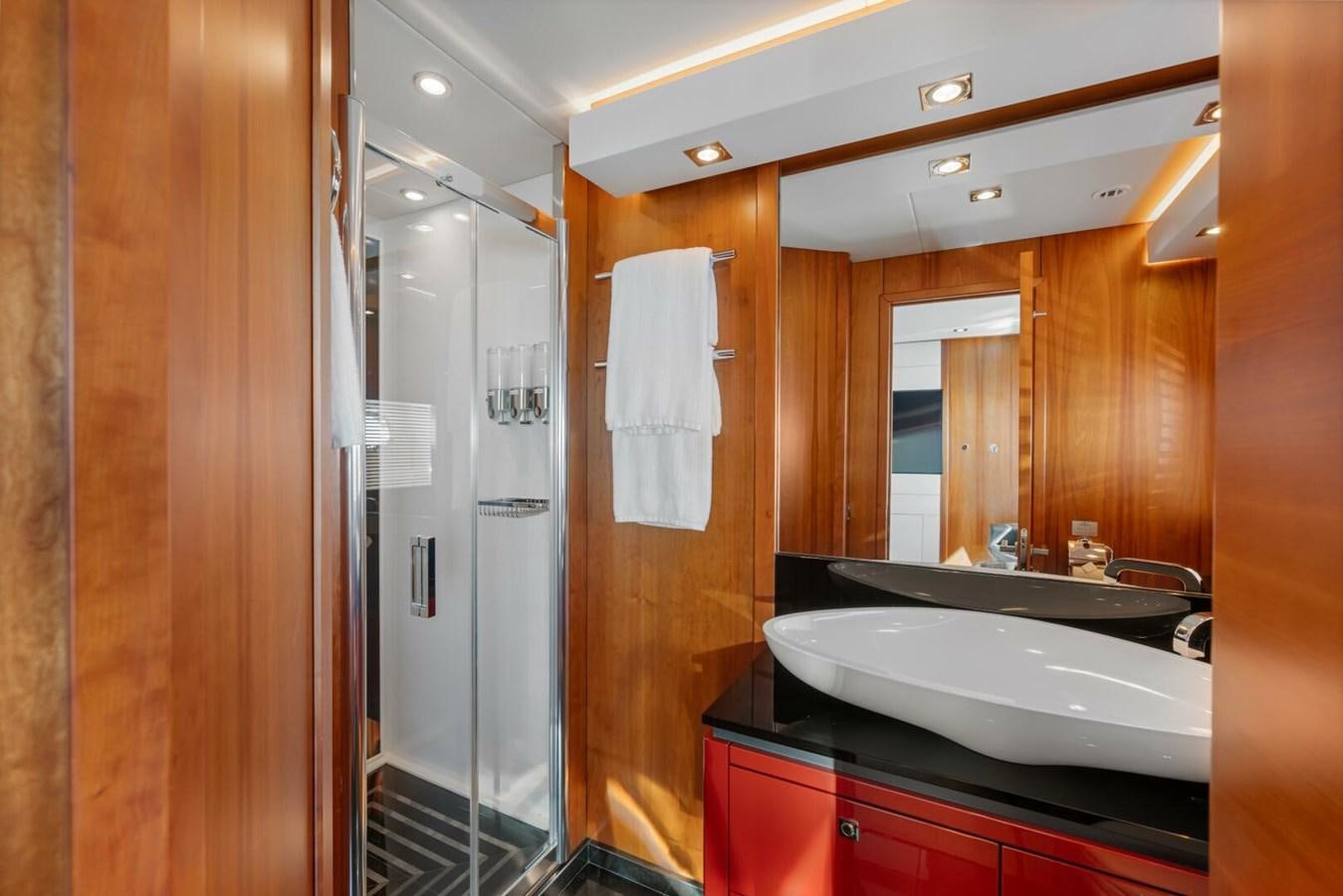 a bathroom with a sink and a shower aboard PREDATOR 84 Yacht for Sale