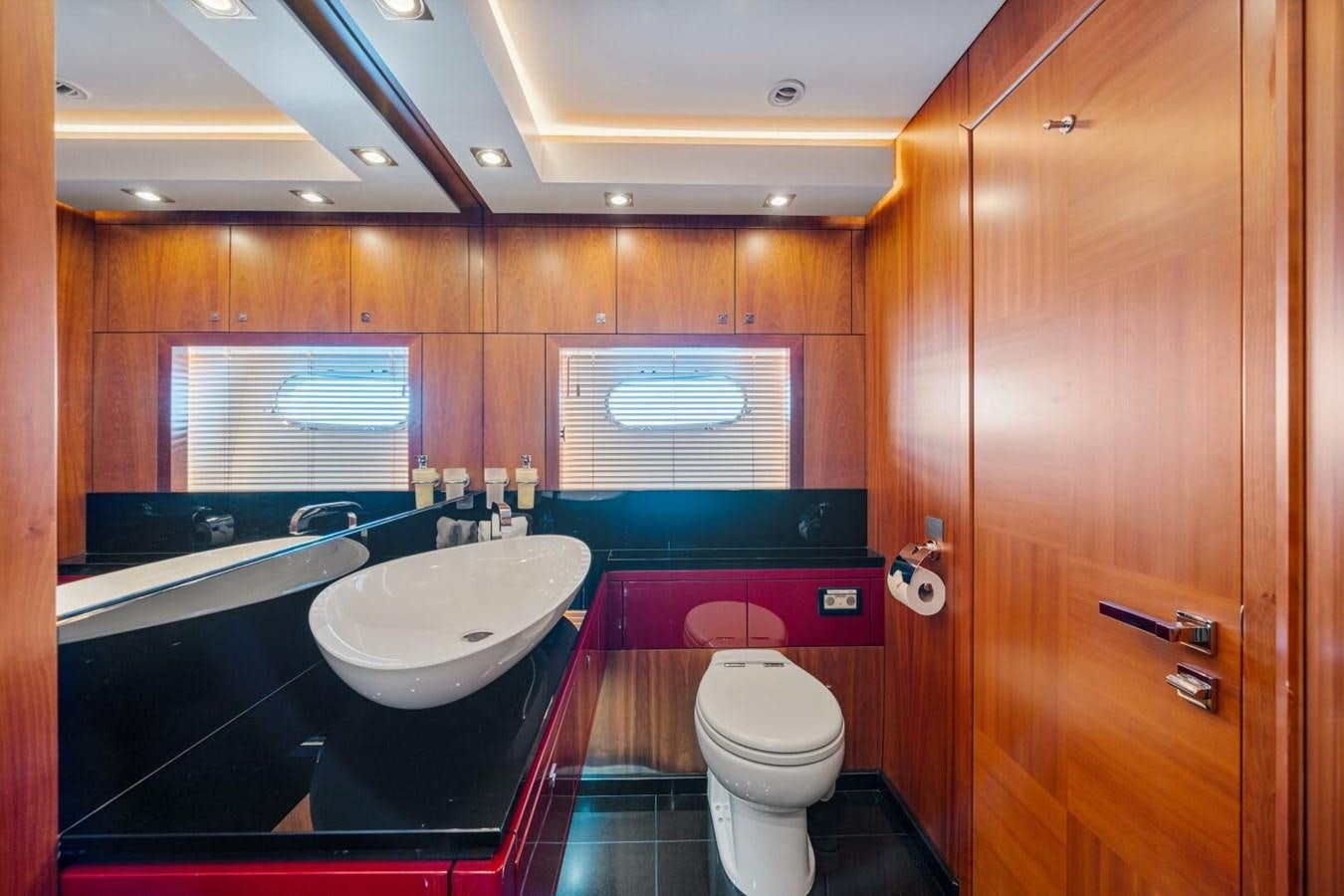 a bathroom with a sink and toilet aboard PREDATOR 84 Yacht for Sale