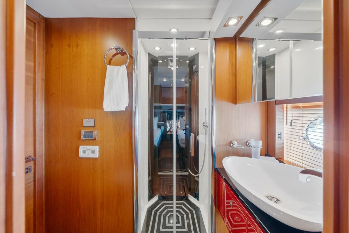a bathroom with a glass shower aboard PREDATOR 84 Yacht for Sale