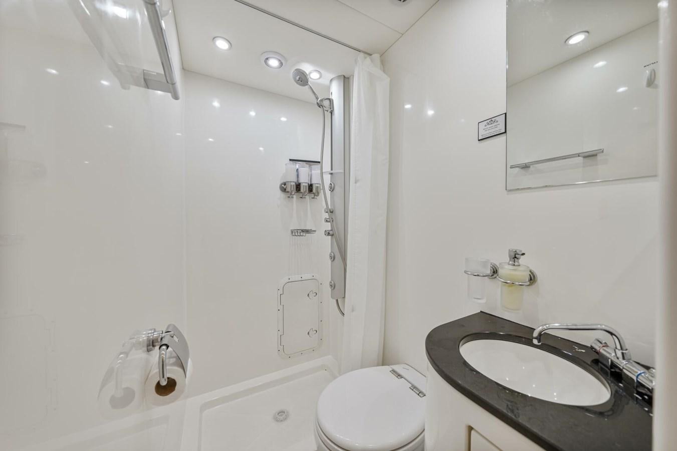 a bathroom with a sink and toilet aboard PREDATOR 84 Yacht for Sale