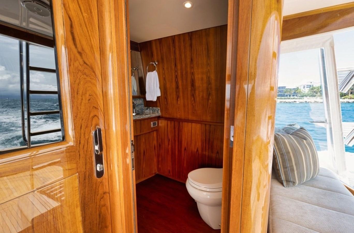 a room with a wood door and a window aboard ARTEMIS Yacht for Sale