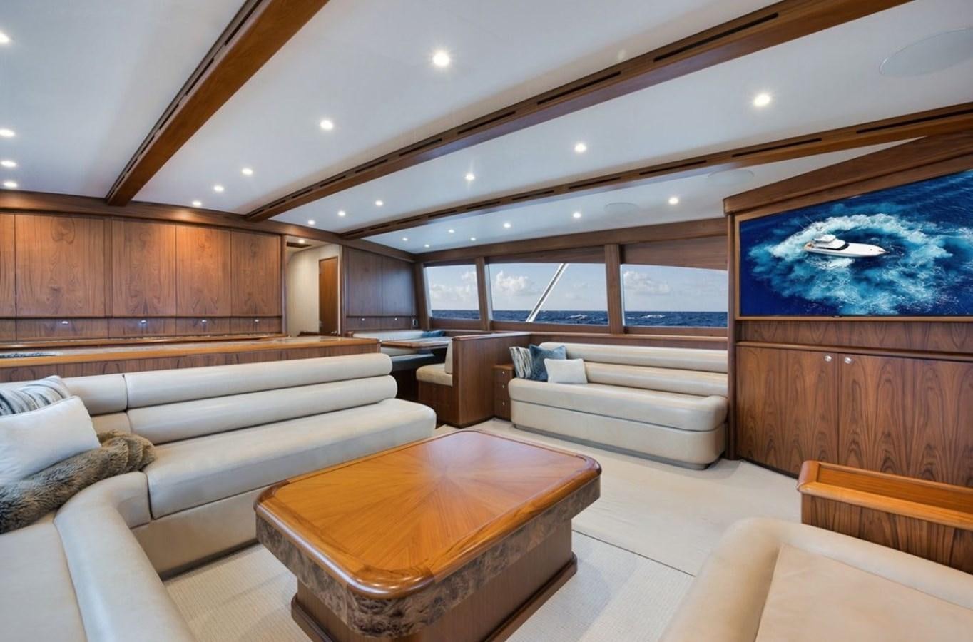 a room with a couch and a tv aboard ARTEMIS Yacht for Sale