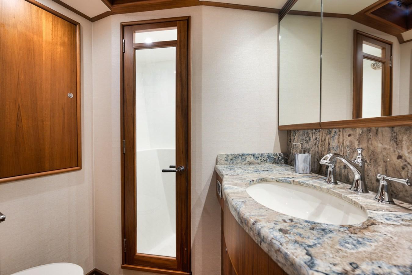 a bathroom with a sink and a mirror aboard ARTEMIS Yacht for Sale