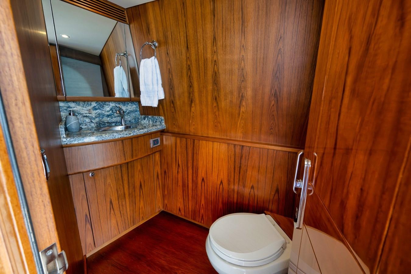 a bathroom with a sink and toilet aboard ARTEMIS Yacht for Sale