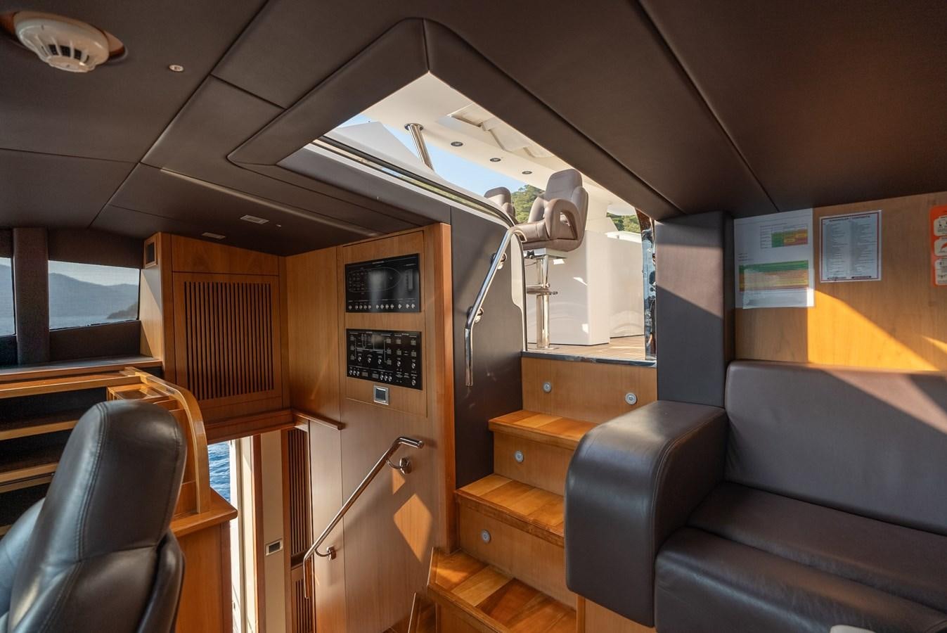 a boat with a ladder aboard ROUND MIDNIGHT Yacht for Sale