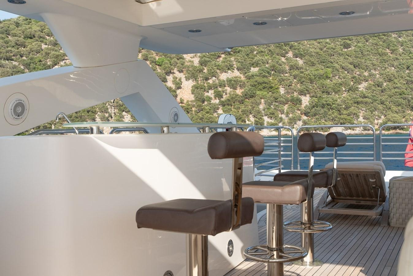 a table and chairs on a deck aboard ROUND MIDNIGHT Yacht for Sale
