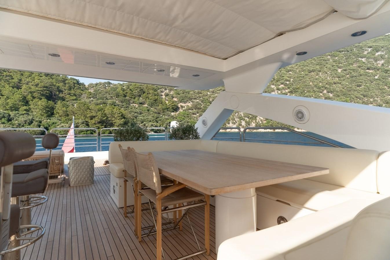 a large white tent with a table and chairs and a pool aboard ROUND MIDNIGHT Yacht for Sale