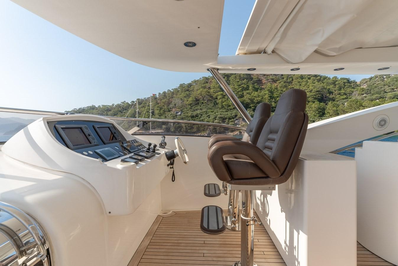 a white car with a large metal propeller on the roof aboard ROUND MIDNIGHT Yacht for Sale
